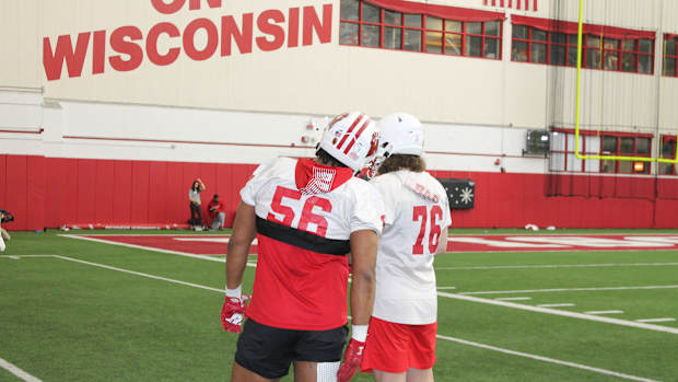 Wisconsin defensive linemen Tommy Brunner (No. 76) and Rodas Johnson *(No. 56)